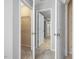 Hallway view with doors to closet, bathroom and bedrooms with neutral carpet at 2459 Memory Ridge Dr, Raleigh, NC 27606