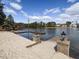 Stunning lakefront with sandy area and dock, ideal for outdoor activities and waterfront living at 2459 Memory Ridge Dr, Raleigh, NC 27606