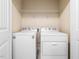 Laundry room with white washer and dryer, wire rack shelving and white doors at 2459 Memory Ridge Dr, Raleigh, NC 27606