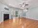 Spacious living room includes fireplace, sliding glass door leading to a covered porch, and hardwood floors at 2459 Memory Ridge Dr, Raleigh, NC 27606