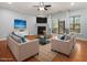Bright living room features a fireplace, backyard view, and comfortable seating arrangement at 2459 Memory Ridge Dr, Raleigh, NC 27606