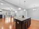 Open concept living room with view into kitchen and sliding door to porch at 2459 Memory Ridge Dr, Raleigh, NC 27606