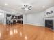 Open-concept living room boasts hardwood floors, fireplace, and seamless flow to kitchen area at 2459 Memory Ridge Dr, Raleigh, NC 27606