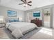 Beautiful main bedroom with soft lighting, carpet, blue accents and decorative wall art at 2459 Memory Ridge Dr, Raleigh, NC 27606