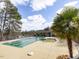Stunning community pool featuring a pristine swimming area, splash pool, lakeside views, and comfortable lounging for residents at 2459 Memory Ridge Dr, Raleigh, NC 27606
