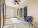Inviting screened-in porch with comfortable seating, a ceiling fan, and access to the yard at 2459 Memory Ridge Dr, Raleigh, NC 27606