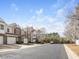 Street view of well-maintained townhomes with garages and tidy landscaping at 2459 Memory Ridge Dr, Raleigh, NC 27606