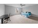 Large bedroom with carpeted floors, black desk, and a chair providing an adaptable space at 2500 Plowridge Rd, Fuquay Varina, NC 27526