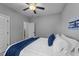 Comfortable bedroom with carpeted floors, a ceiling fan and two closets for storage at 2500 Plowridge Rd, Fuquay Varina, NC 27526
