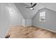 Attic bonus room with wood floors, a window, and slanted ceilings at 2500 Plowridge Rd, Fuquay Varina, NC 27526