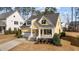 Charming home with a welcoming front porch, well-maintained landscaping, and attached two-car garage at 2500 Plowridge Rd, Fuquay Varina, NC 27526