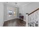 Spacious foyer with hardwood floors, staircase, and double front doors at 2500 Plowridge Rd, Fuquay Varina, NC 27526