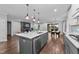 Kitchen island connects to the open living and dining areas, perfect for modern living at 2500 Plowridge Rd, Fuquay Varina, NC 27526