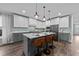 Beautiful kitchen features a large island with pendant lighting and stainless steel appliances at 2500 Plowridge Rd, Fuquay Varina, NC 27526