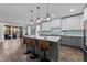 Stylish kitchen with modern cabinetry, quartz countertops, and pendant lighting at 2500 Plowridge Rd, Fuquay Varina, NC 27526