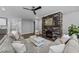 Bright living room with stone fireplace and hardwood floors at 2500 Plowridge Rd, Fuquay Varina, NC 27526