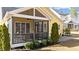 Relaxing screened-in porch with ceiling fan and backyard views at 2500 Plowridge Rd, Fuquay Varina, NC 27526