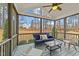 Enjoy outdoor living on this screened porch with comfortable seating and views of the backyard at 2500 Plowridge Rd, Fuquay Varina, NC 27526