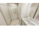 Bathroom with tiled shower, glass door, and vanity with double sinks at 287 Beacon Dr, Pittsboro, NC 27312