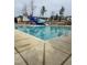 Large community swimming pool with diving board and slides for endless fun at 287 Beacon Dr, Pittsboro, NC 27312