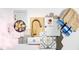 Home design palette featuring backsplash tiles, carpet and cabinet samples, and a gold faucet at 287 Beacon Dr, Pittsboro, NC 27312