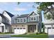Charming two-story home with a brick facade, attached garage, and covered front porch in a suburban neighborhood at 287 Beacon Dr, Pittsboro, NC 27312