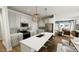 Kitchen with white cabinets, stainless steel appliances, an island, and pendant lighting at 287 Beacon Dr, Pittsboro, NC 27312