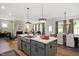 Open concept kitchen flows into the dining and living area; perfect for entertaining at 287 Beacon Dr, Pittsboro, NC 27312