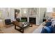 Bright living room features a fireplace, neutral color palette, and wood floors at 287 Beacon Dr, Pittsboro, NC 27312