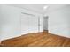 Light bedroom with hardwood floors, closet and door to another room at 303 Granville Rd, Chapel Hill, NC 27514