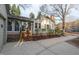 Exterior view of the home with a well-maintained yard, patio, and a blend of siding and brick at 303 Granville Rd, Chapel Hill, NC 27514
