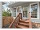 Front entrance with small deck and stairs at 303 Granville Rd, Chapel Hill, NC 27514