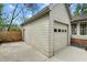 Detached garage with ample parking, a well-maintained exterior, and an adjacent entrance to the home at 303 Granville Rd, Chapel Hill, NC 27514