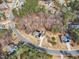 A high aerial shot showcases a two-story home featuring solar panels, a trampoline, and a fenced-in backyard at 330 Bridgeport Cir, Clayton, NC 27527
