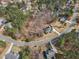 Overhead angle shows a well-maintained property in wooded neighborhood, close to neighborhood shopping and businesses at 330 Bridgeport Cir, Clayton, NC 27527