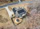 A high aerial shot showcases a two-story home featuring solar panels, a trampoline, and a fenced-in backyard at 330 Bridgeport Cir, Clayton, NC 27527