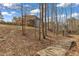 Wooded backyard has a playhouse and wooden bridge to the main house at 330 Bridgeport Cir, Clayton, NC 27527