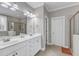 Bright bathroom featuring double vanity, shower and separate tub; perfect for relaxing in style at 330 Bridgeport Cir, Clayton, NC 27527