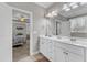 A bright bathroom featuring double vanity and a view to the bedroom at 330 Bridgeport Cir, Clayton, NC 27527