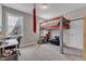 Bedroom features a loft bed with an office and study space at 330 Bridgeport Cir, Clayton, NC 27527
