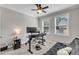 A bedroom featuring carpeted floors, a ceiling fan, and natural light from two windows at 330 Bridgeport Cir, Clayton, NC 27527