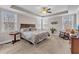 A bedroom featuring a spacious layout, large bed, and multiple windows at 330 Bridgeport Cir, Clayton, NC 27527