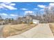Charming home with a long driveway and solar panels, surrounded by mature trees and an expansive front lawn at 330 Bridgeport Cir, Clayton, NC 27527