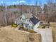 An aerial view shows a beautiful home with solar panels, a well-kept lawn, and manicured landscaping at 330 Bridgeport Cir, Clayton, NC 27527