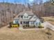 A beautiful home boasts a well-kept lawn, manicured landscaping, and inviting front porch at 330 Bridgeport Cir, Clayton, NC 27527