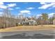 Spacious two-story home situated on a well-manicured lawn, enhanced by mature trees and a serene neighborhood setting at 330 Bridgeport Cir, Clayton, NC 27527