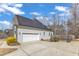 Two-car garage with solar panels installed on a beautiful home's side exterior at 330 Bridgeport Cir, Clayton, NC 27527