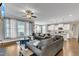 Open concept living room featuring hardwood floors, a ceiling fan, and lots of natural light at 330 Bridgeport Cir, Clayton, NC 27527