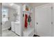 A mud room including storage and a bench with access to laundry room and exterior door at 330 Bridgeport Cir, Clayton, NC 27527