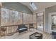 Relaxing sunroom with wood floors, natural light from skylight and forest views at 330 Bridgeport Cir, Clayton, NC 27527